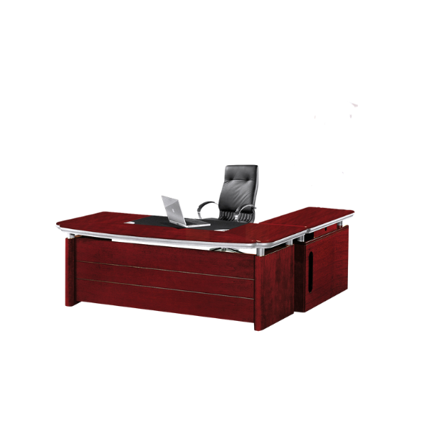 Modern executive office desk made of dark reddish-brown wood with metallic accents, featuring a black leather desk mat, an open silver laptop, and a black leather office chair with armrests behind it. The desk has a large main surface and a side extension, creating a sleek professional workspace.