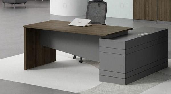 "Explore the Executive Elegance L-Shaped Desk—a modern marvel available in three sizes (1.6m, 1.8m, 2m), featuring a sleek melamine surface, L-shaped design, and three drawers for seamless storage. Elevate your workspace with this contemporary masterpiece, perfectly balancing style and functionality for the discerning executive."