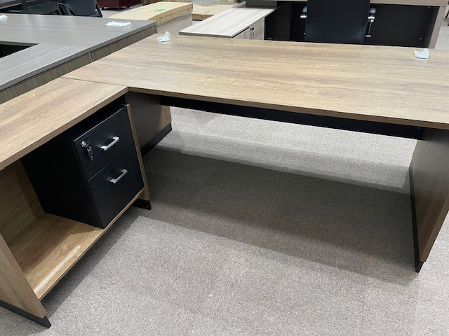 The 1.8m L-shaped Cornerstone Office Desk features durable melamine construction and two built-in drawers for convenient storage