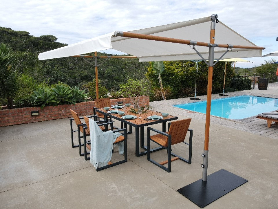 Woodline Tuli Patio Set featuring a hardwood table and six chairs with durable eucalyptus frames and marine-grade steel, suitable for outdoor dining.